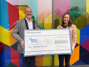 jessica ennis-hill and steve warren holding a cheque