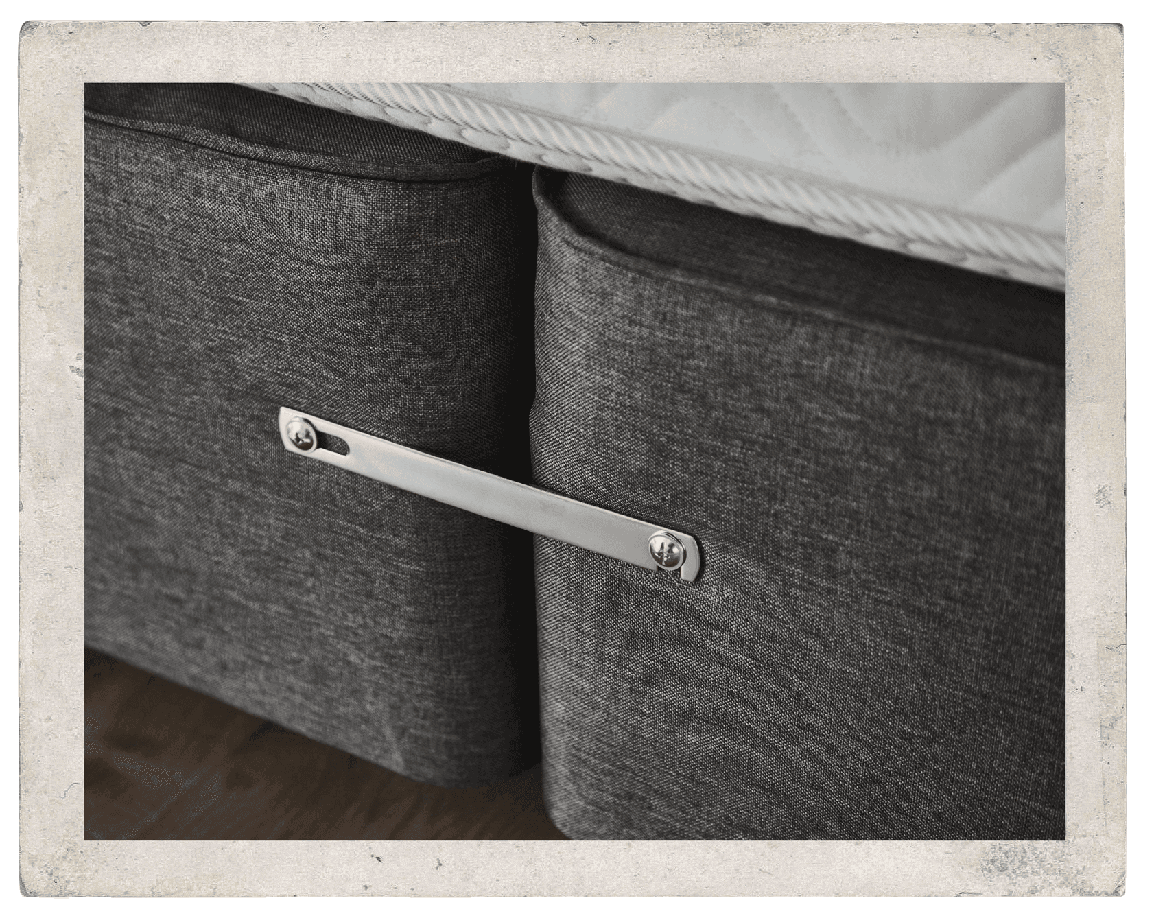A close up of a divan with a linking bar